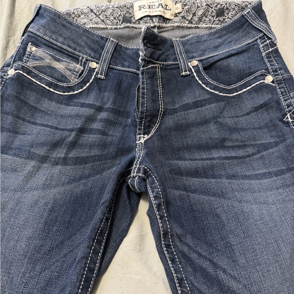 Ariat Women's Dark Blue mid rise straight Jeans with Contrast Stitching.